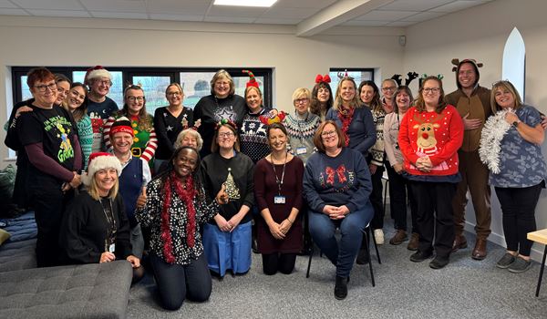 Staff dressed in Christmas jumpers